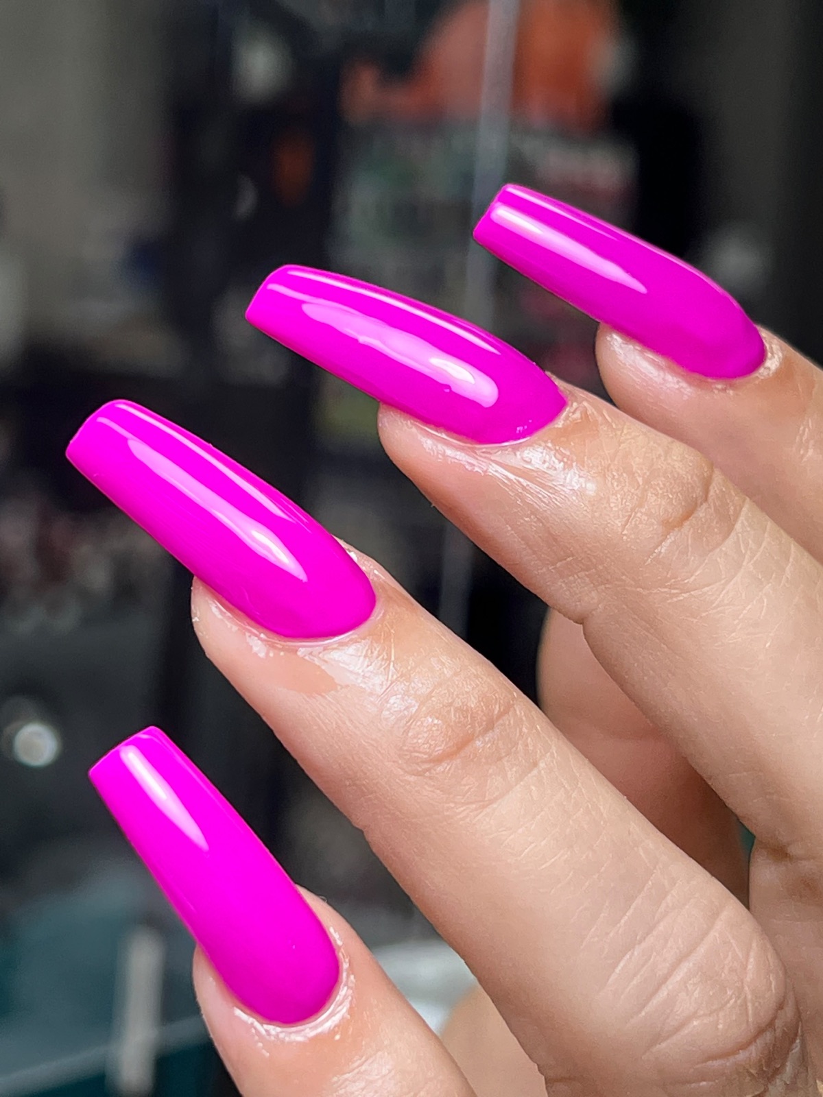 Glossy neon pink coffin nails