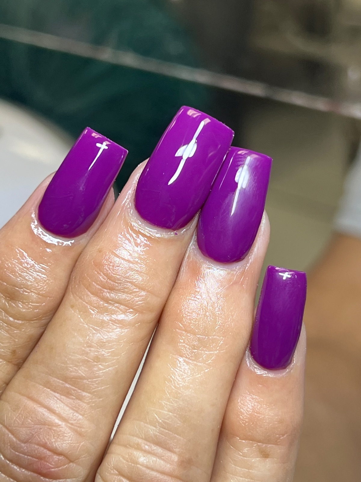 Purple nails with delicate white floral art